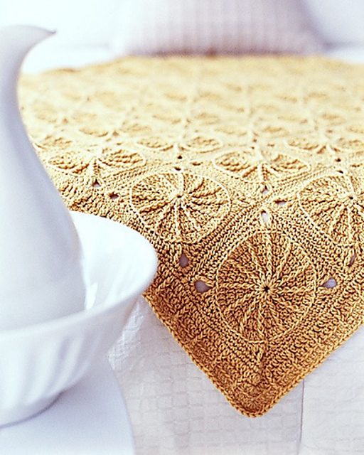 The original Sunny Spread blanket in golden yarn by Ellen Gormley.